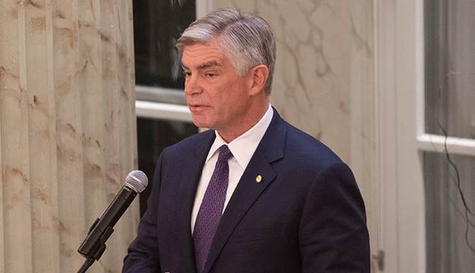 Federal Reserve Bank of Philadelphia President Patrick Harker speaking into a microphone