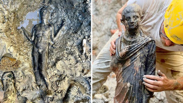 Statues at the site of the discovery of two dozen well-preserved bronze statues from an ancient Tuscan thermal spring in San Casciano dei Bagni, Italy on Nov. 3.