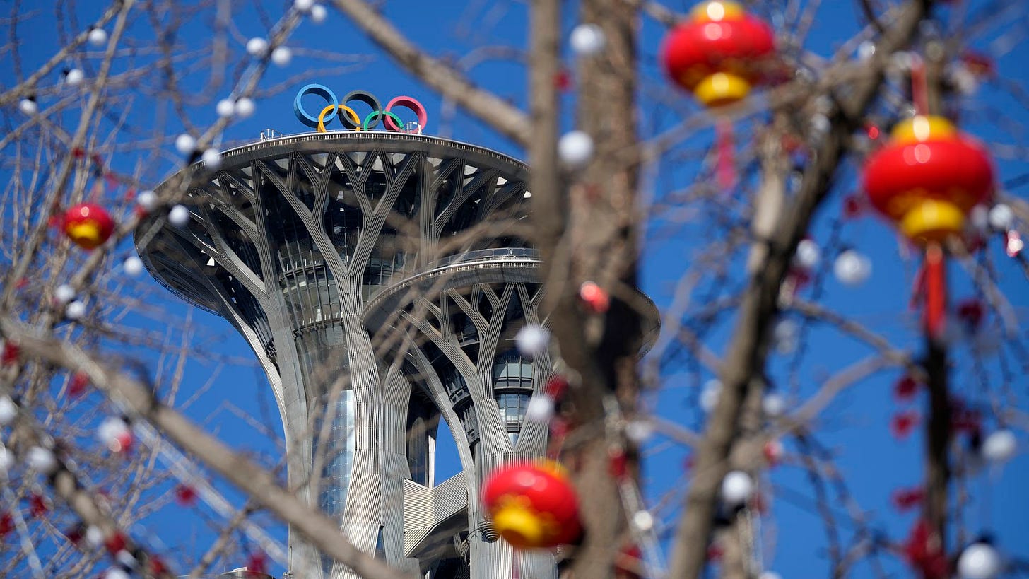 Lantern decorations hang on trees on the Olympic Green near the Olympic Tower in Beijing