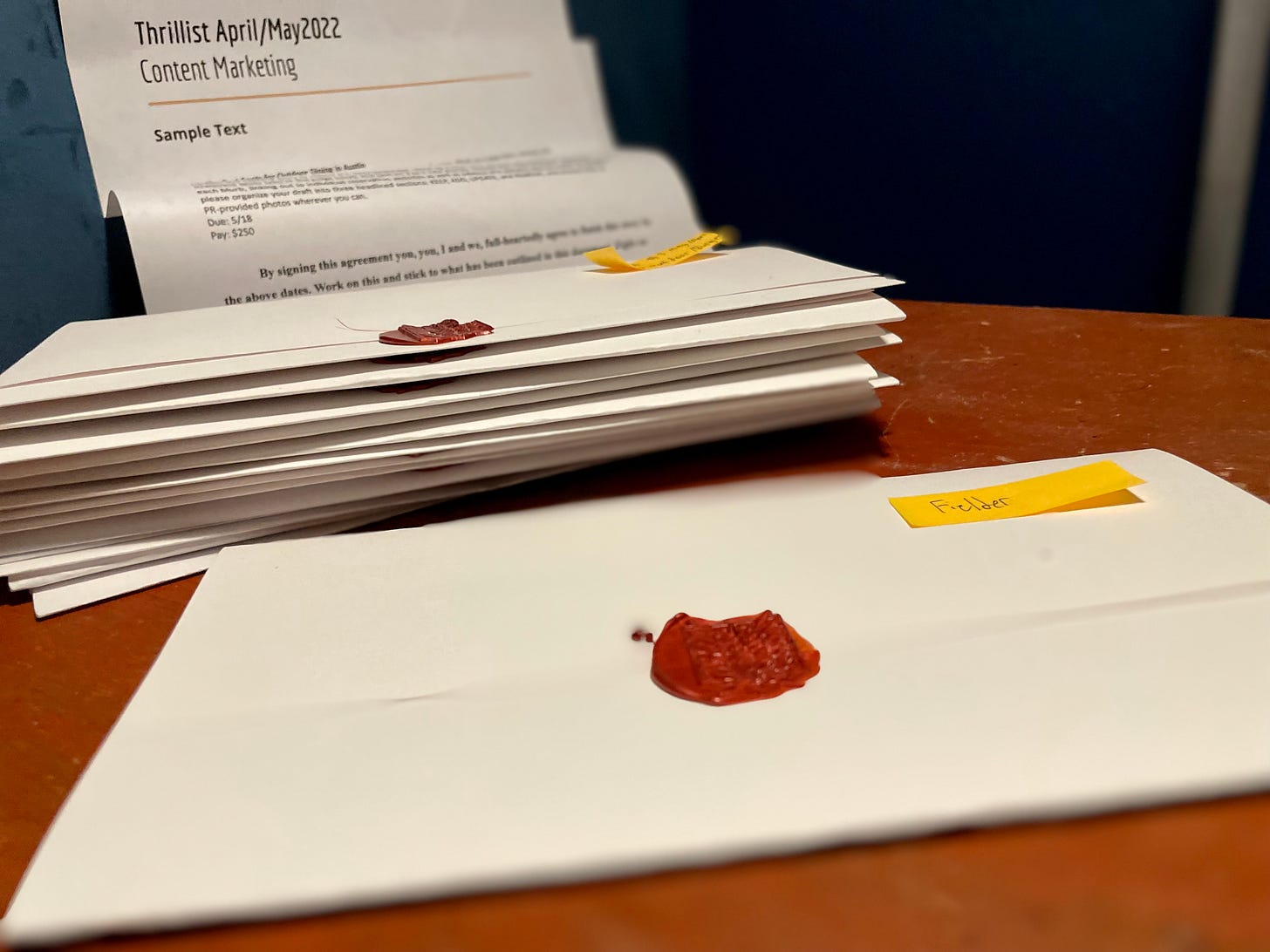 Photo of stack of contracts with wax seals.