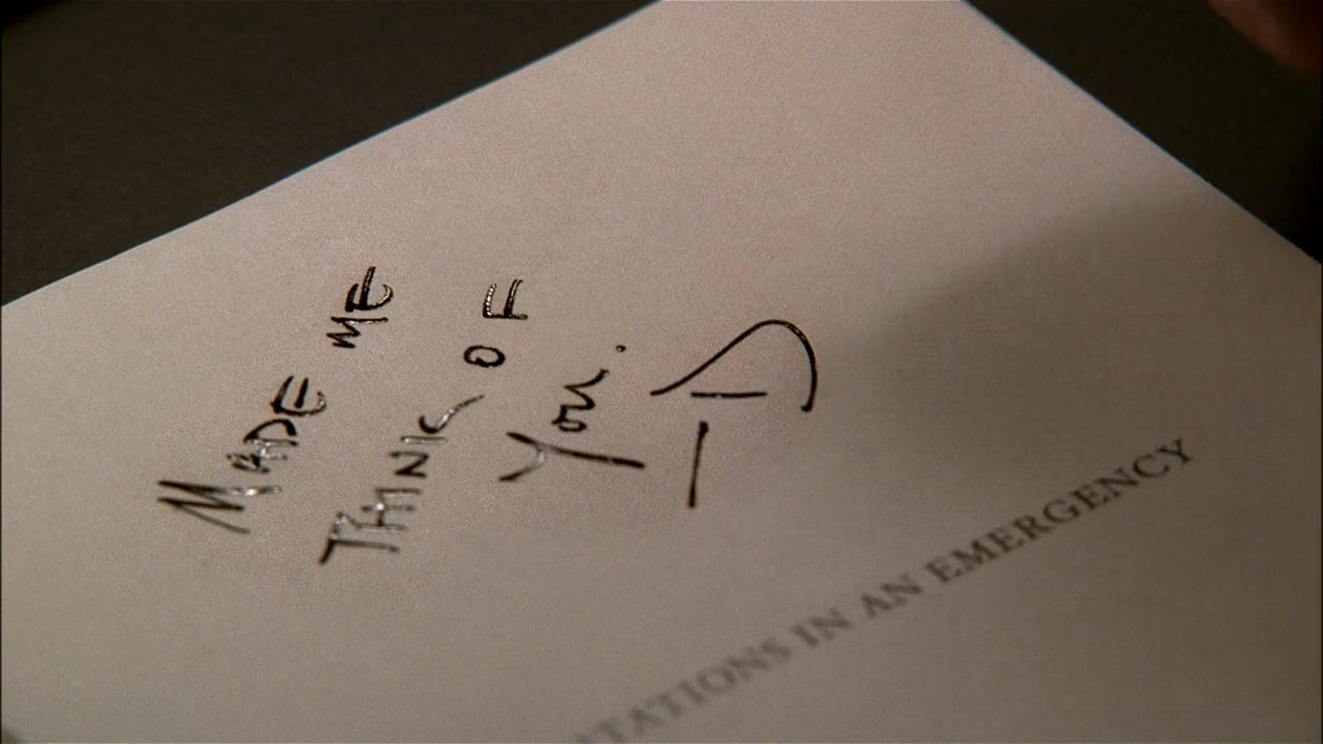 Don writes the inscription "Made me think of you -D" inside O'Hara's Meditations in an Emergency poetry collection on Mad Men