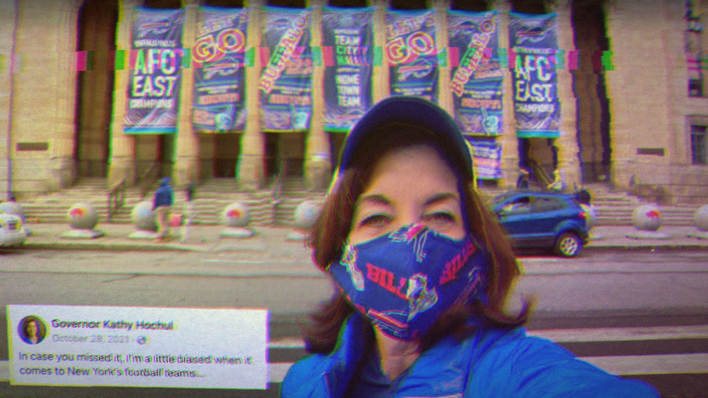 Selfie of Governor Kathy Hochul in front of the Buffalo Bills Stadium, wearing a Buffalo Bills mask. Text on the image says, “Governor Kathy Hochul- In case you missed it, I’m a little biased when it comes to New York’s football teams. Selfie of Governor Kathy Hochul in front of the Buffalo Bills Stadium, wearing a Buffalo Bills mask. Text on the image says, “Governor Kathy Hochul- In case you missed it, I’m a little biased when it comes to New York’s football teams.