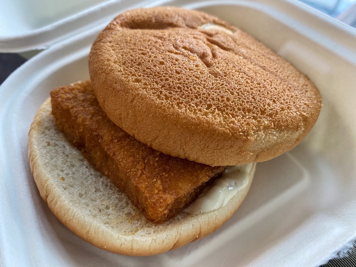 McDonald's Filet-O-Fish, badly put together, with the bun totally askew
