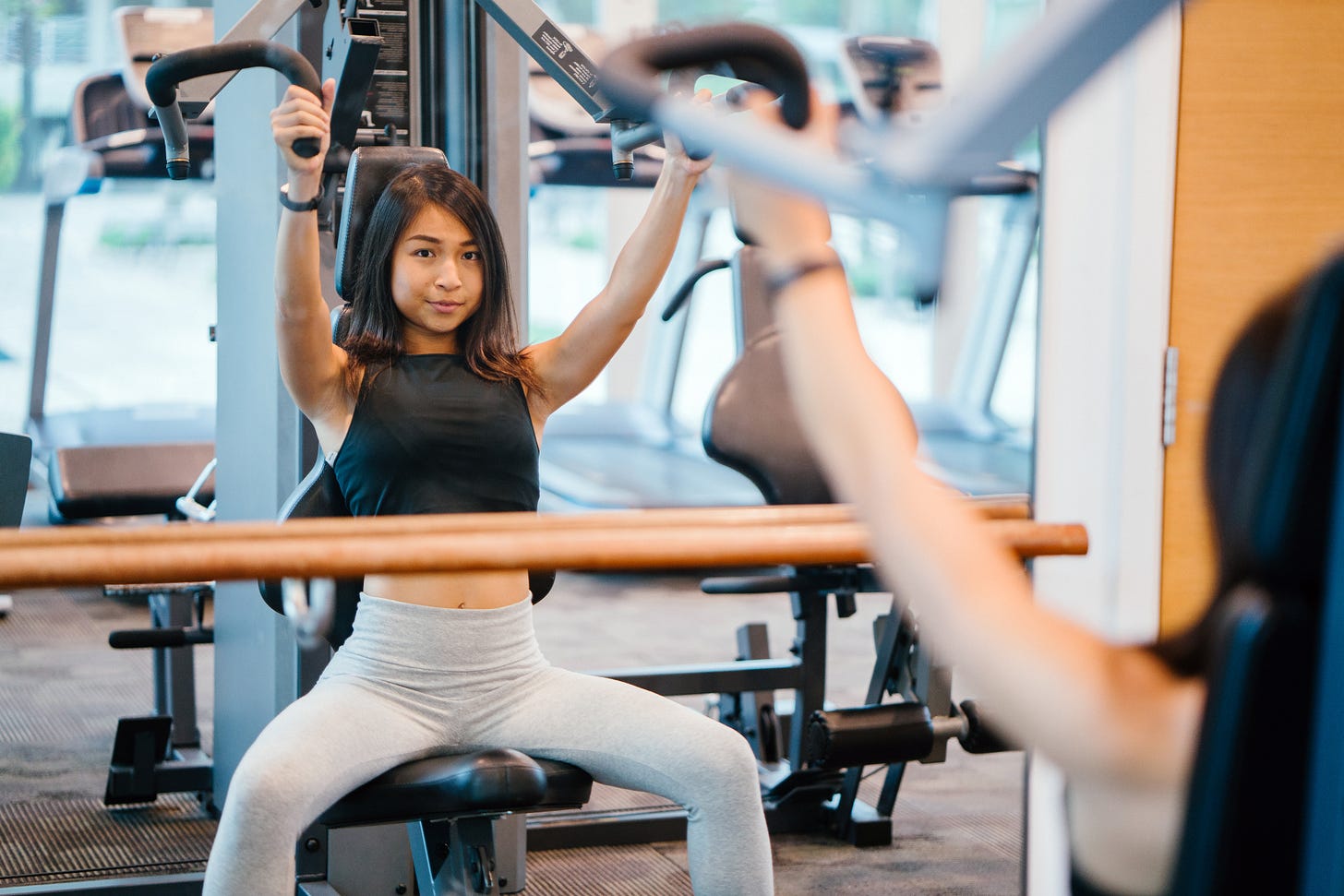a woman working out on a gym machine