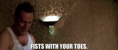 A gif from the film Die Hard when John McClane first reaches Nagatomi Tower and takes off his shoes. The caption reads: "Fists with your toes"