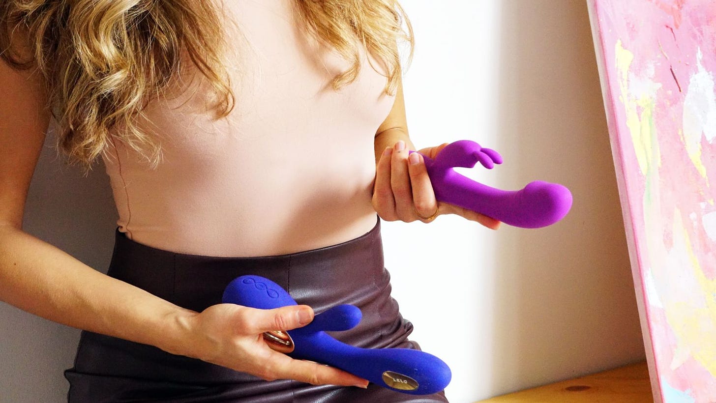 sexy woman holding sex toys