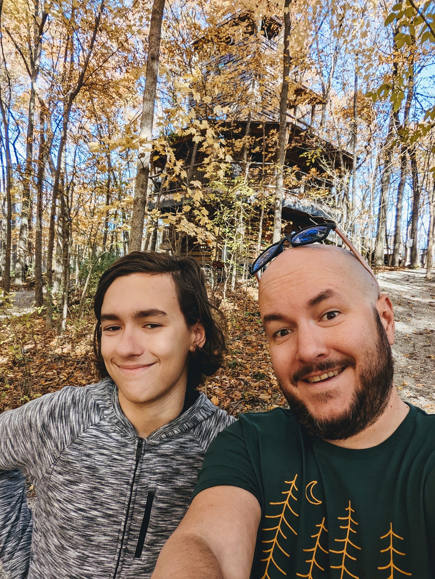 Selfie of me and my son in the woods at Conner Prairie
