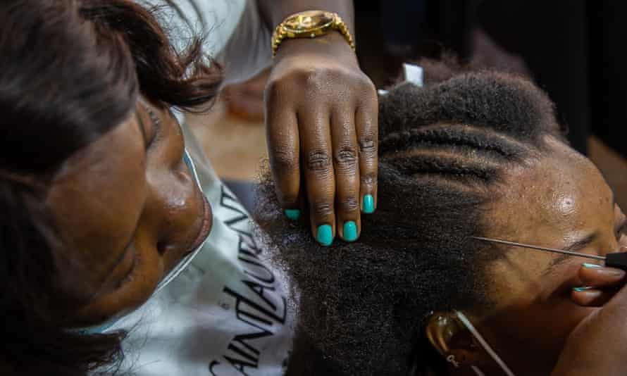 Florida Ngouma braids Khadija Niang’s hair at Salon Tra, specialises in natural African hair styles, Dakar, Senegal April 202