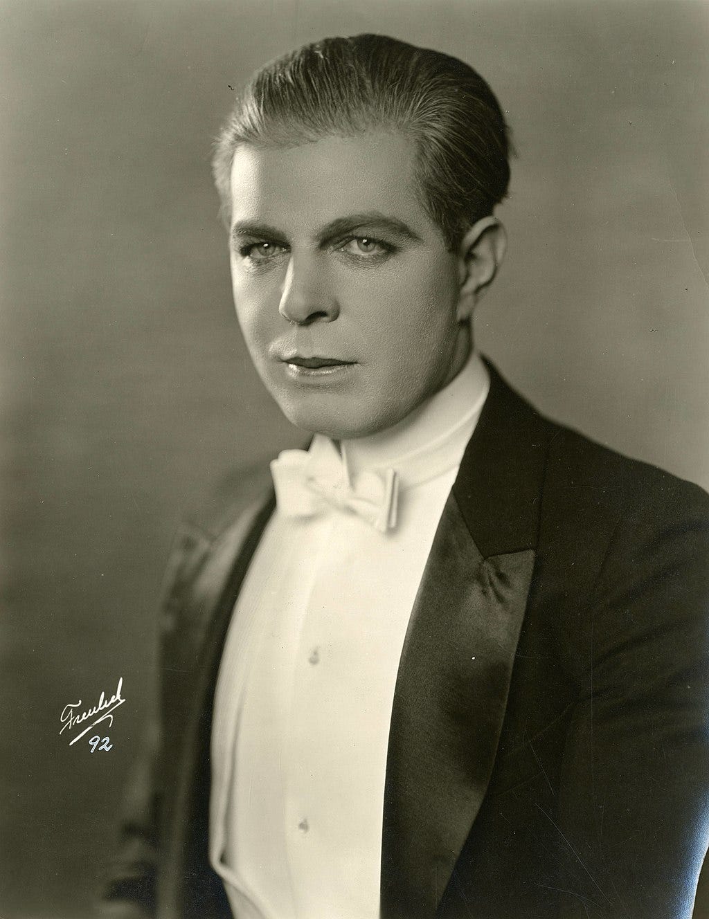 Black and white portrait photograph of Hoot Gibson in about 1922.