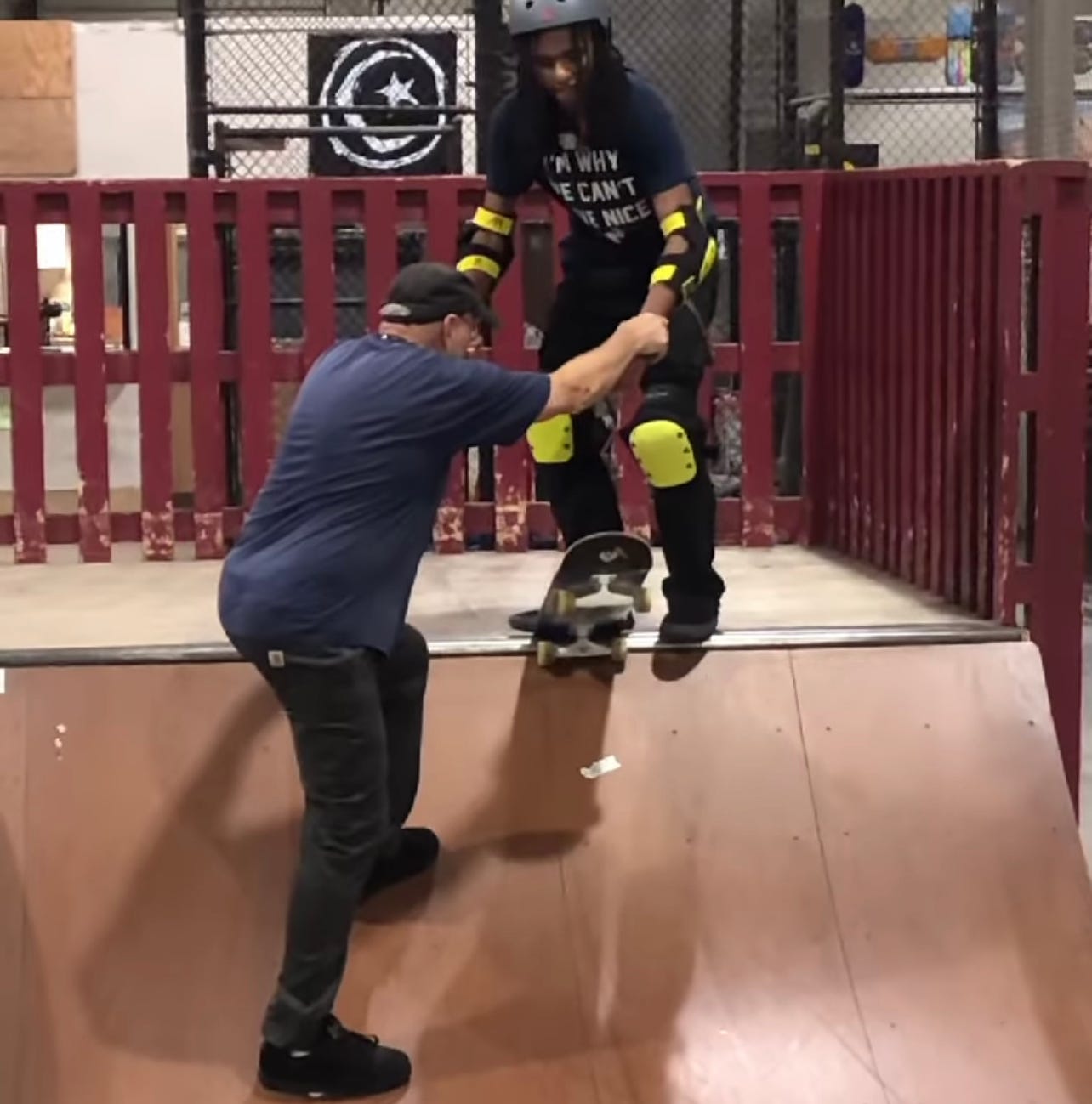 Owner of Modern Skate, George Leichtweis teaching Blind Skater, Coco Atama how to drop in for the first time in his life