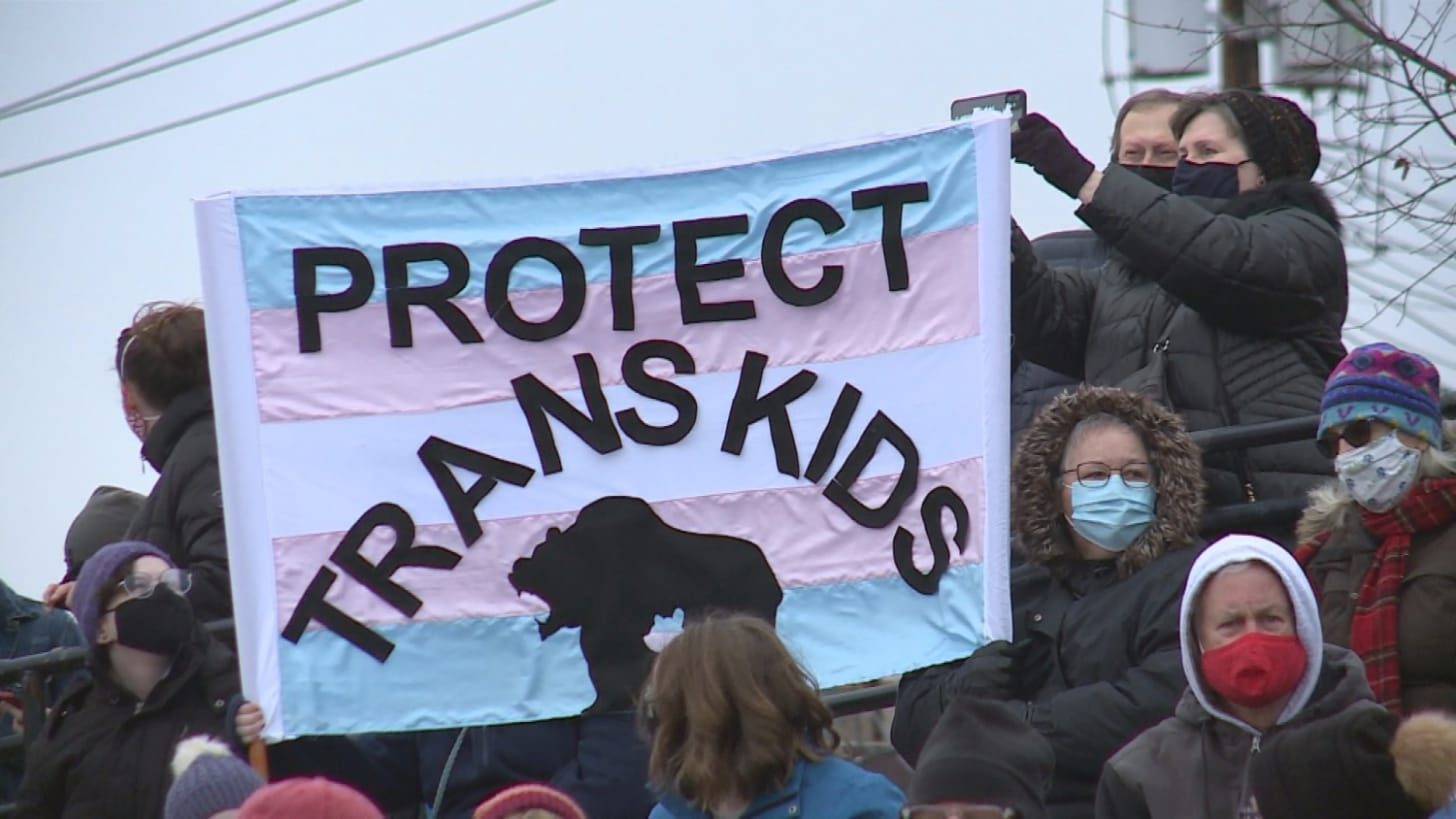 Hundreds rally in support of trans student outed in a bitter election