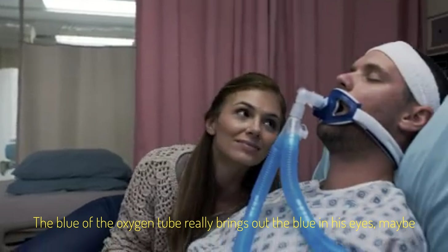 Amelia gazing at an unconscious and intubated man, captioned "The blue of the oxygen tube really brings out the blue in his eyes, maybe"