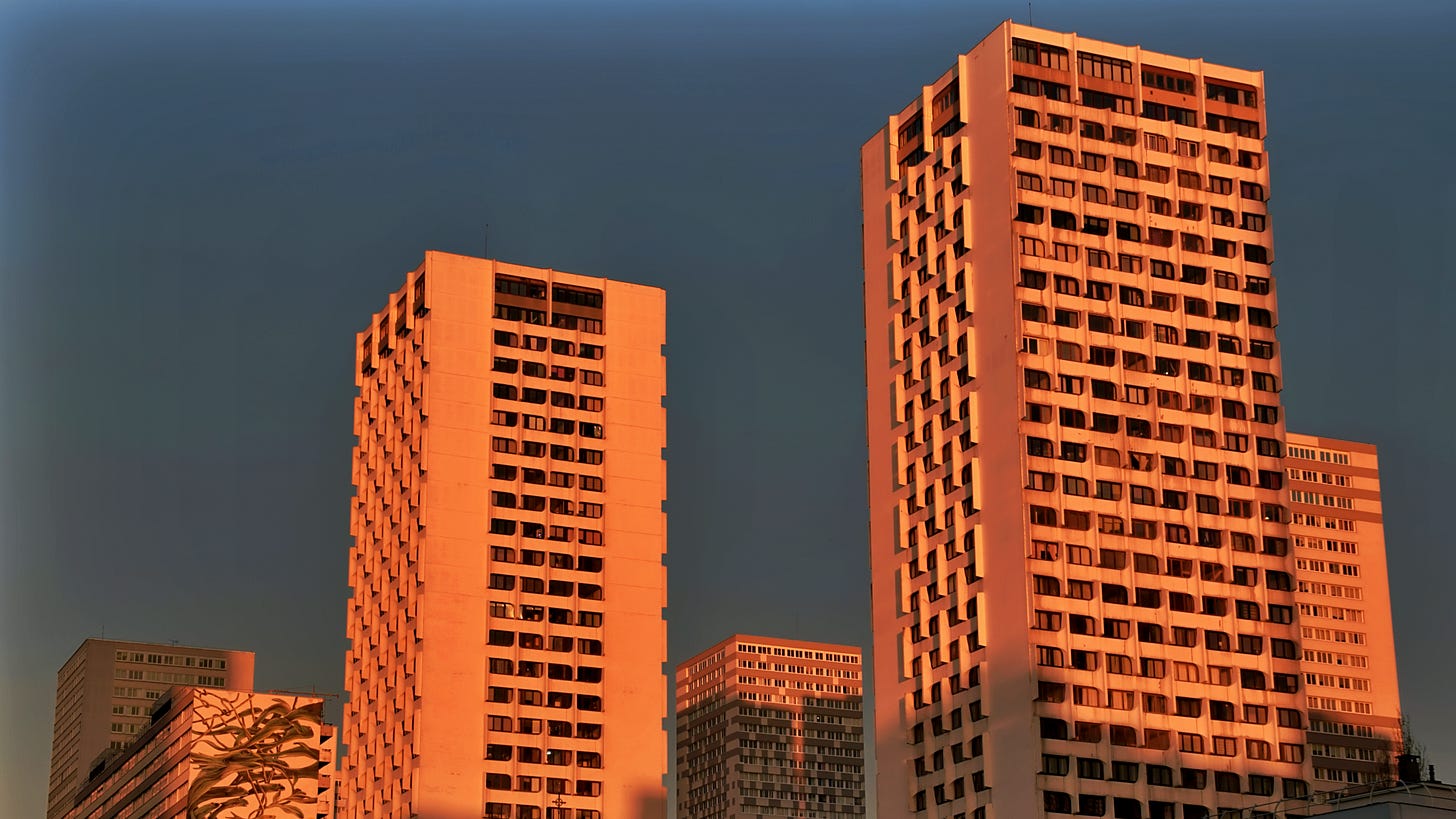 5 30-storey apartment buildings bathed in rose-pink sunshine