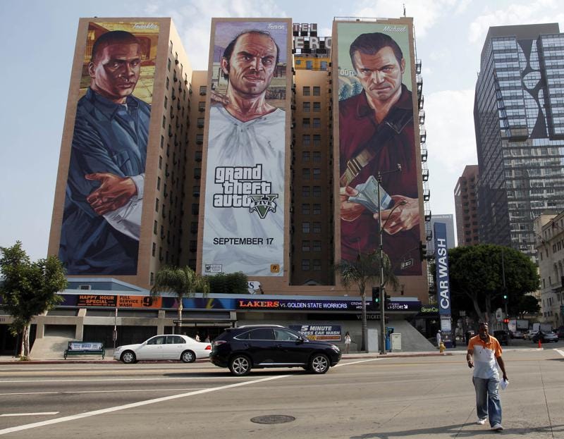 FILE - A "Grand Theft Auto V" billboard is displayed at Figueroa Hotel on Sept. 10, 2013, in Los Angeles. Video game producer Rockstar Games said Monday, Sept. 19, 2022, that early development footage from the next version of its popular title Grand Theft Auto was stolen in the hack of its network. (AP Photo/Nick Ut, File)