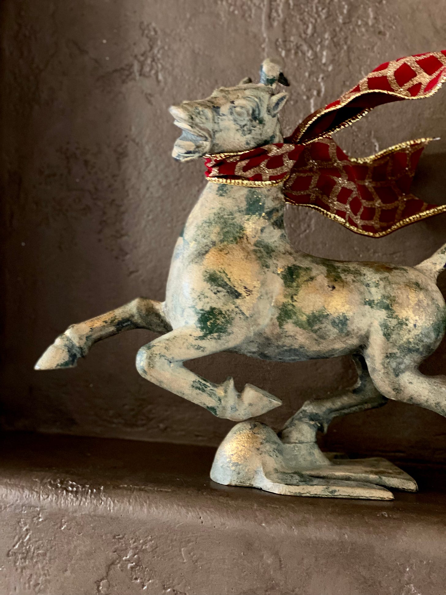 braying japanese cast iron metal horse, patina green, scarf on its neck, ornament, by koreen heaver