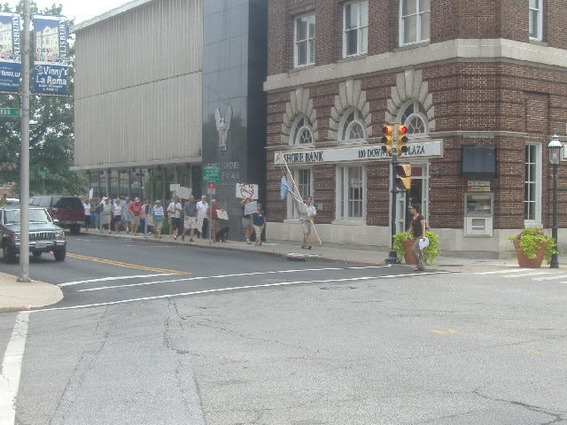 The protestors began their impromptu march in the library parking lot and walked the two blocks to Congressman Frank Kratovil's Salisbury regional office.