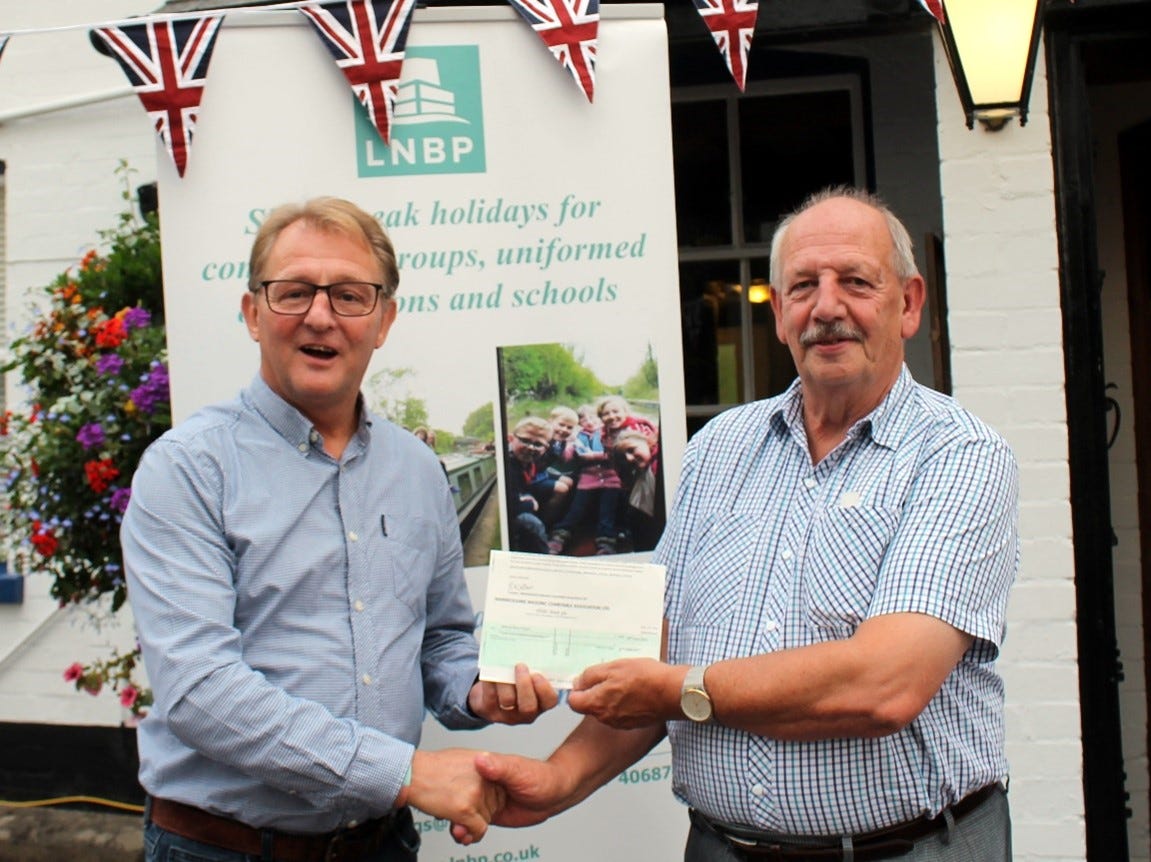 Presenting the cheque to LNBP. Picture submitted.