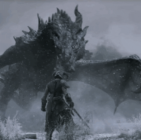 numa paisagem cinzenta de neve, um dragão cinza escuro gigantesco abre a boca em direção a uma pessoa de armadura (minúscula em comparação)