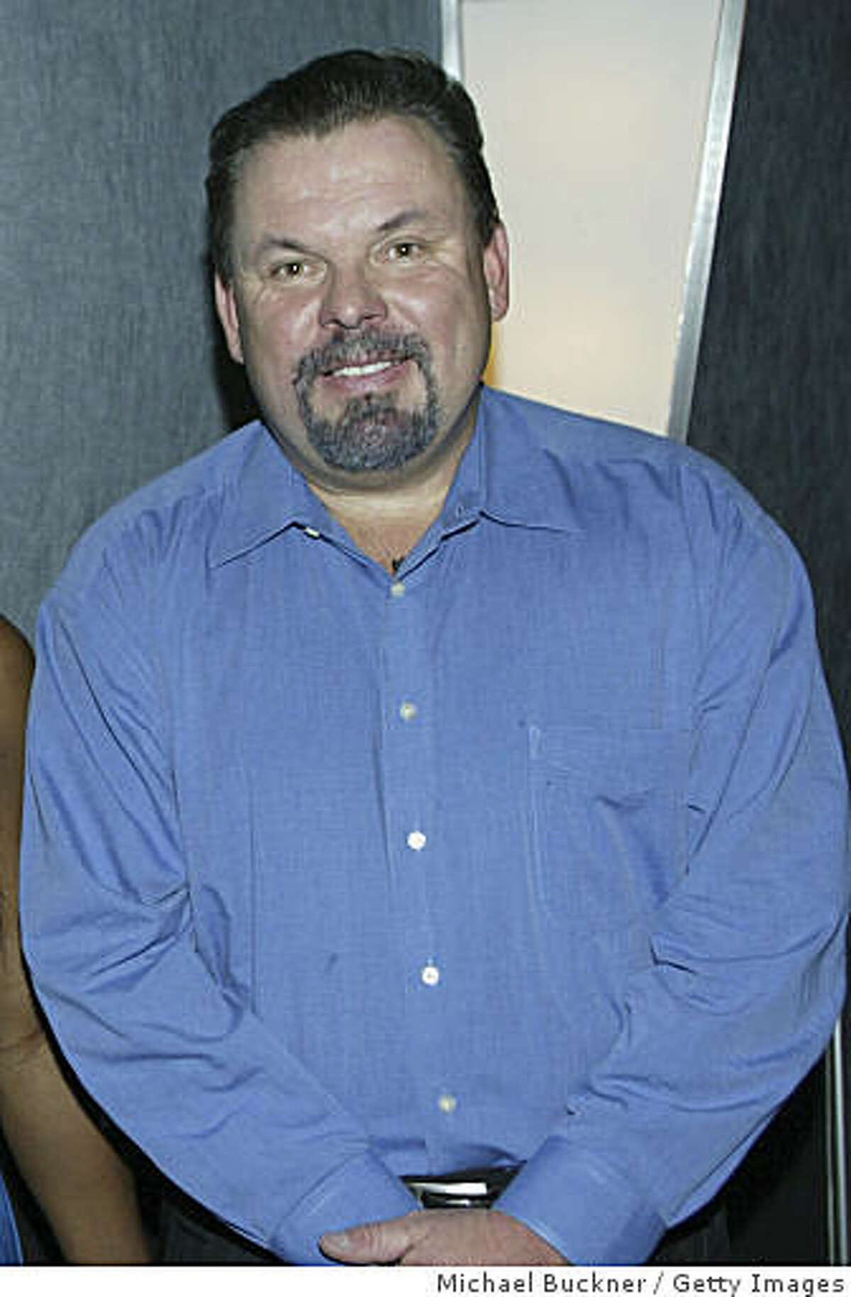 LOS ANGELES - NOVEMBER 22: Painter Thomas Kinkade pose at the "We Are Family" recording session at the Chalice Recording Studios on November 22, 2005 in Los Angeles, California. (Photo by Michael Buckner/Getty Images)