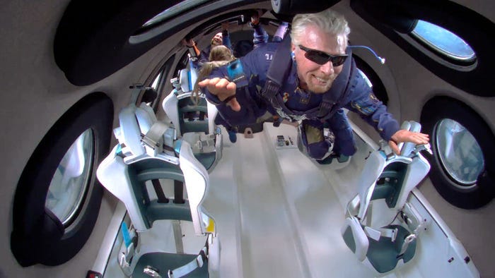 Richard Branson and his crewmates flying in zero gravity in Virgin Galactic's spacecraft