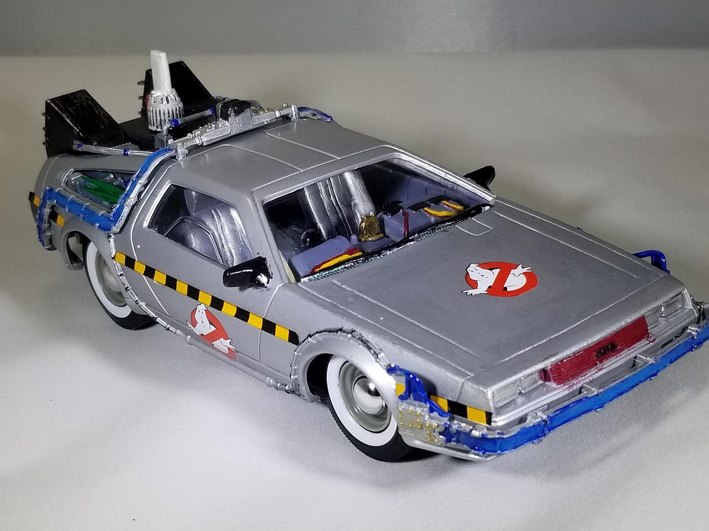 Kit Bash - The Ecto-88 from Ernest Cline&#39;s &quot;Ready Player One,&quot; modeled  after his real-world version of the car. It combines the DeLorean time  machine with the Ghostbusters Ecto-1 and a K.I.T.T.