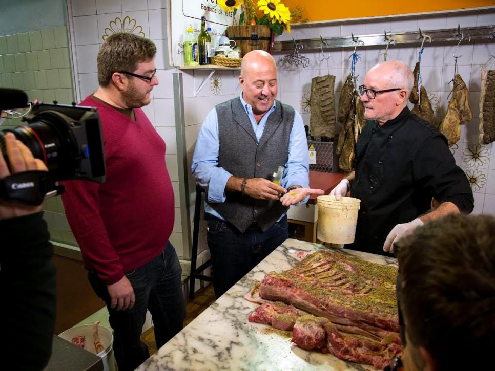Andrew Zimmern at a butcher shop in Rome.