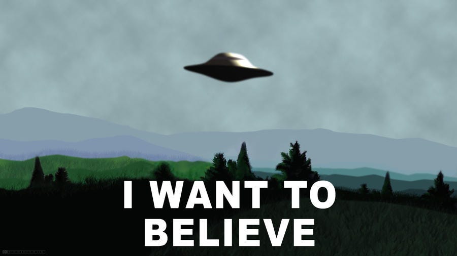Flying saucer with text "I want to believe"