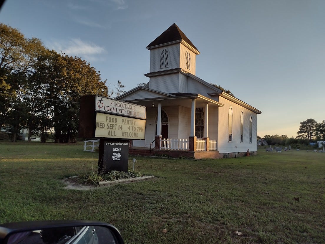 Small church with sign advertising food pantry