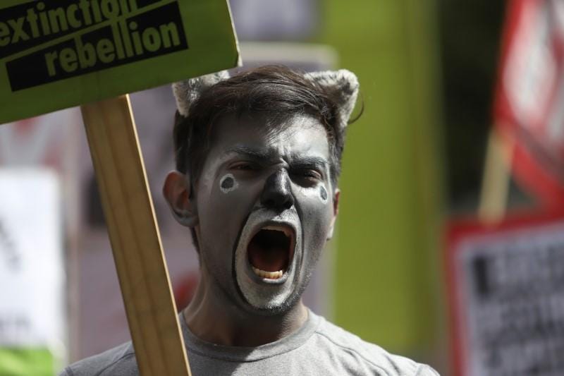 Climate change protests stretch to London as Australia bushfires rage ...