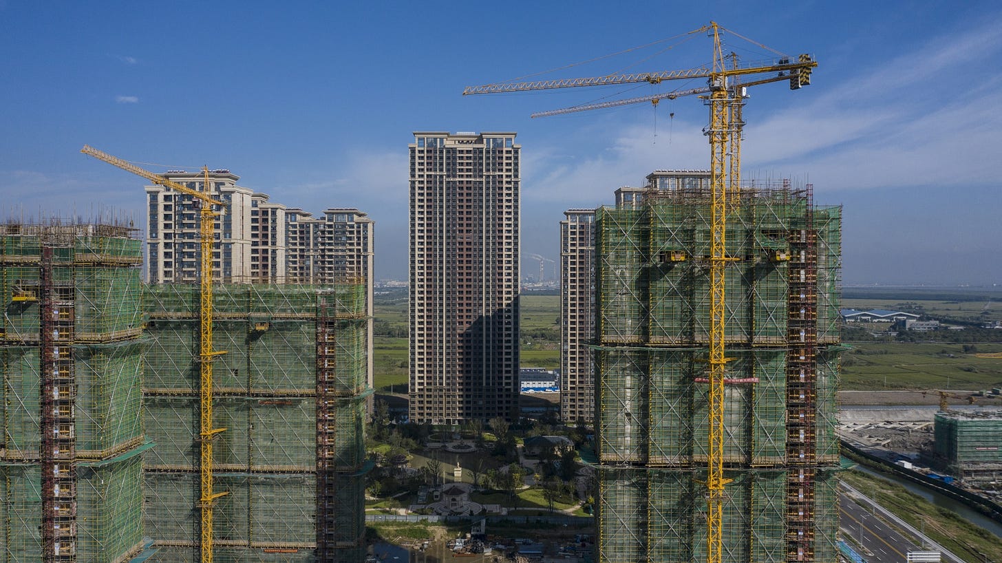 High-rise apartment buildings at China Evergrande Group's Riverside Palace development under-construction in Taicang, Jiangsu province, China. High-rise apartment buildings at China Evergrande Group's Riverside Palace development under-construction in Taicang, Jiangsu province, China.
