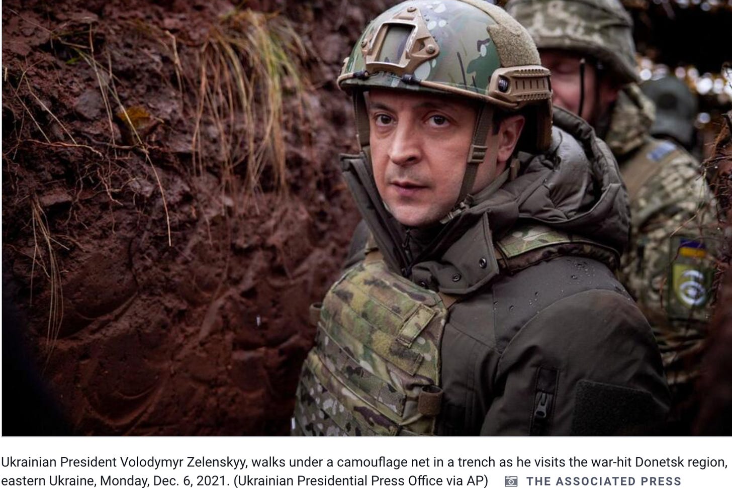 Ukrainian president in a muddy bunker in army gear