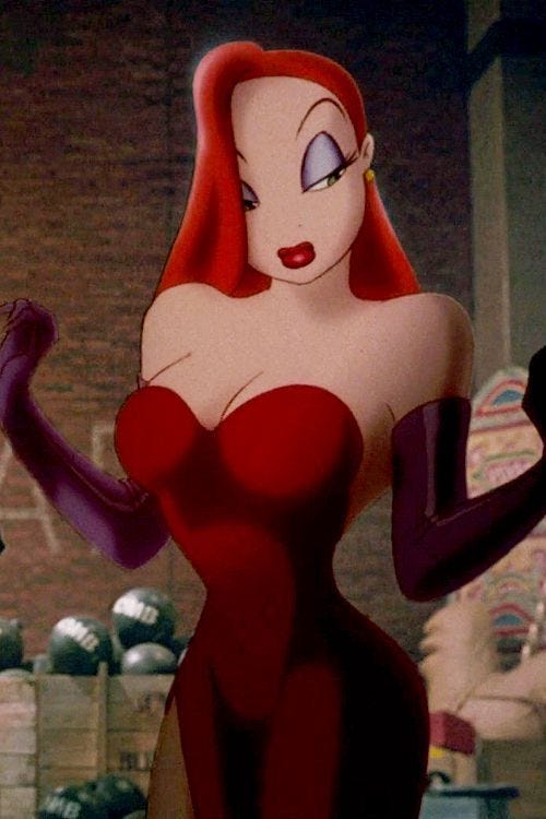 Jessica Rabbit stands in her signature red gown and purple gloves, looking to the side as the camera faces her, in Who Framed Roger Rabbit? (1988)