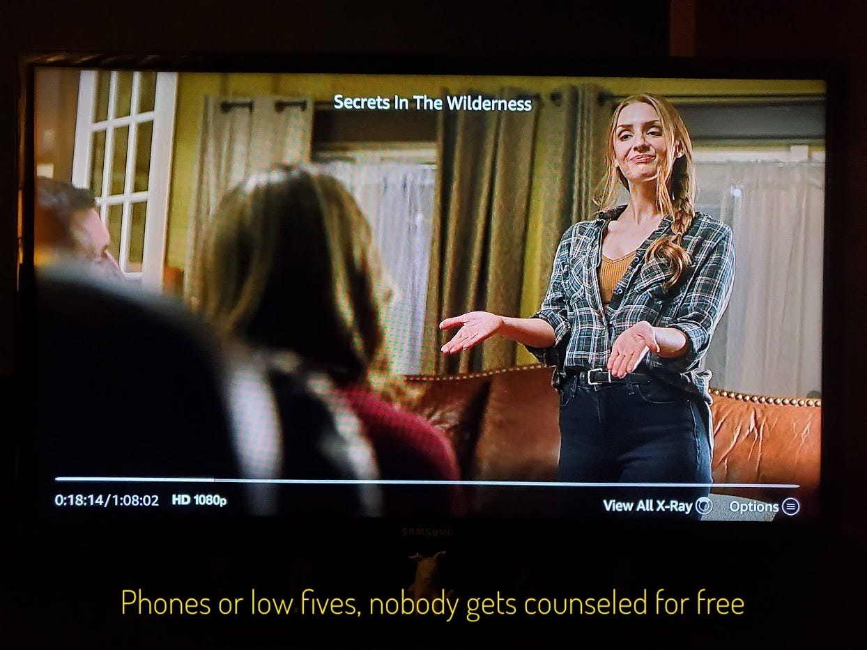 Alana, a smug white woman with long hair and a flannel shirt, holding her hands out, captioned "phones or low fives, nobody gets counseled for free." Does this joke make sense? Unclear