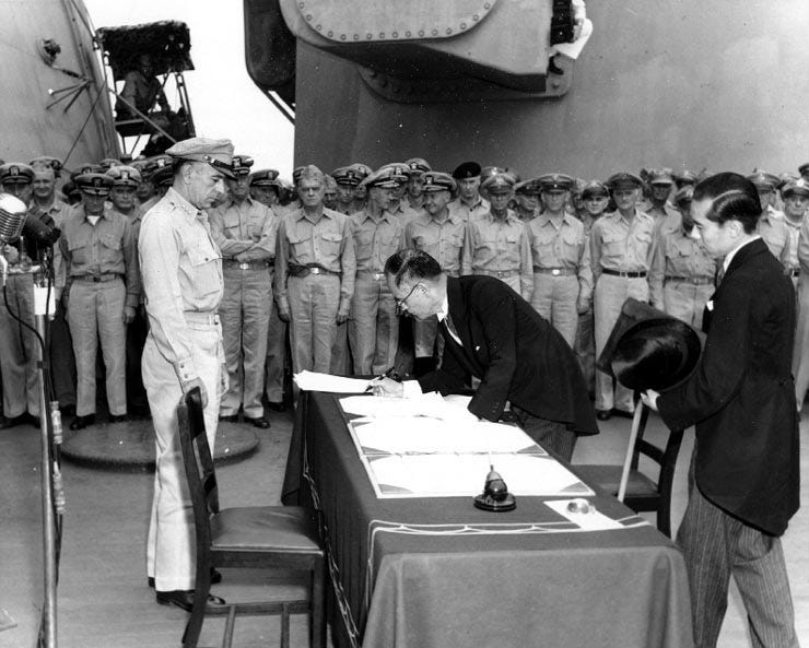 Surrender documents are signed aboard USS Missouri.