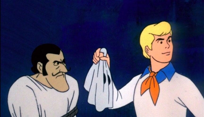 Fred from Scooby-Doo unmasking a villain.