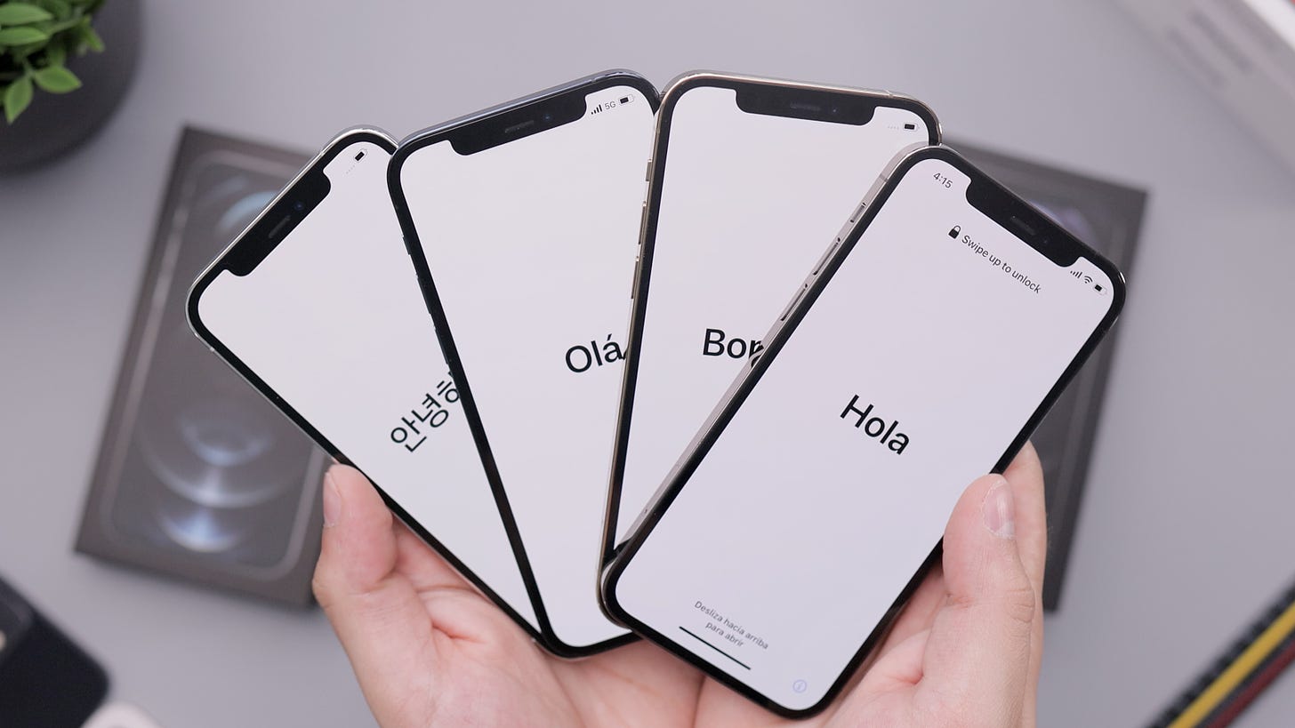 Four new iPhones are displayed with the “hello” text in different languages: Korean, Portuguese, French, and Spanish.