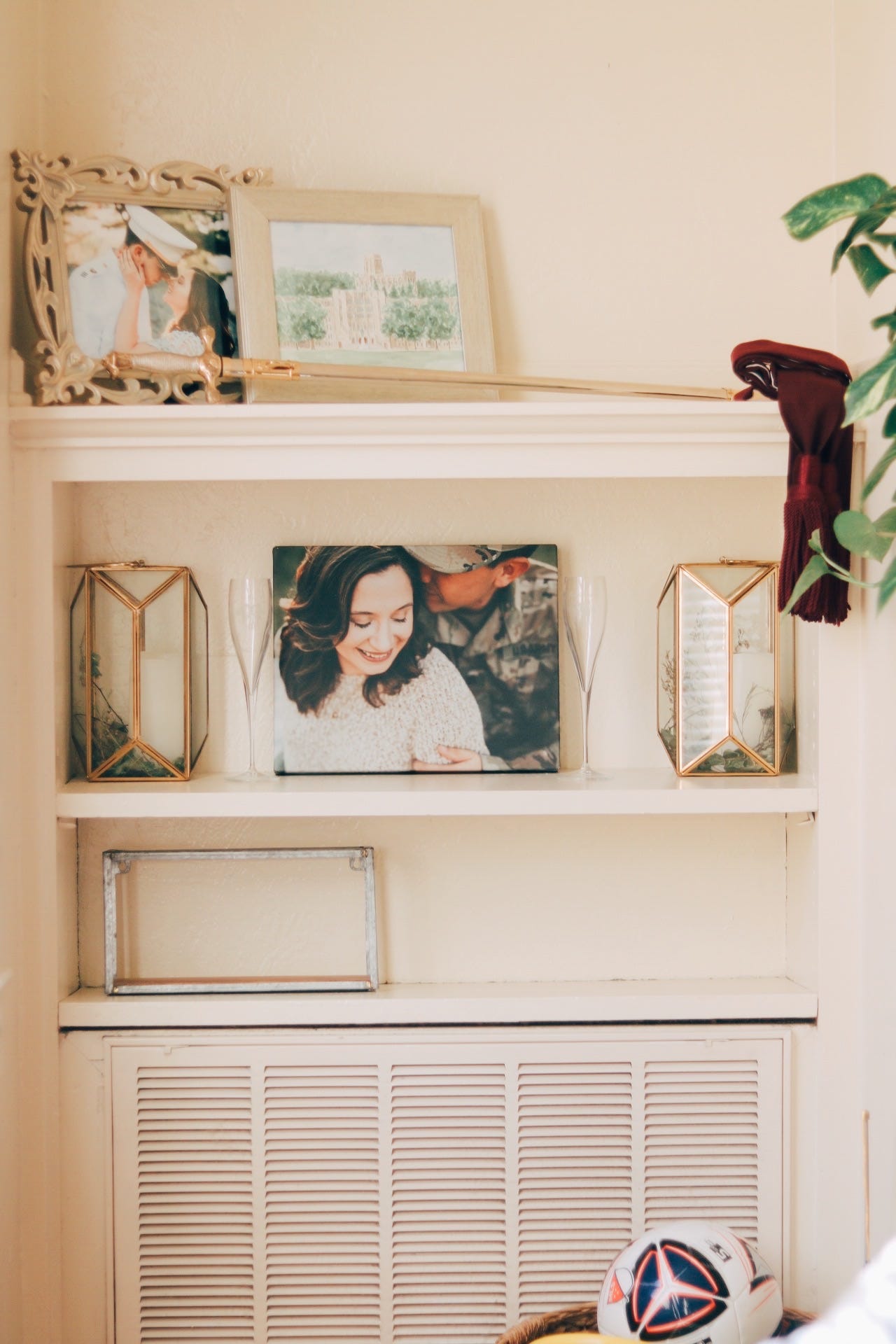  My other favorite thing about our house is the built ins. I know I’m going to miss them so much when we PCS. We used them as a way to display some of Justin’s things from West Point and of course, tons of pictures. They’re not entirely done yet but 