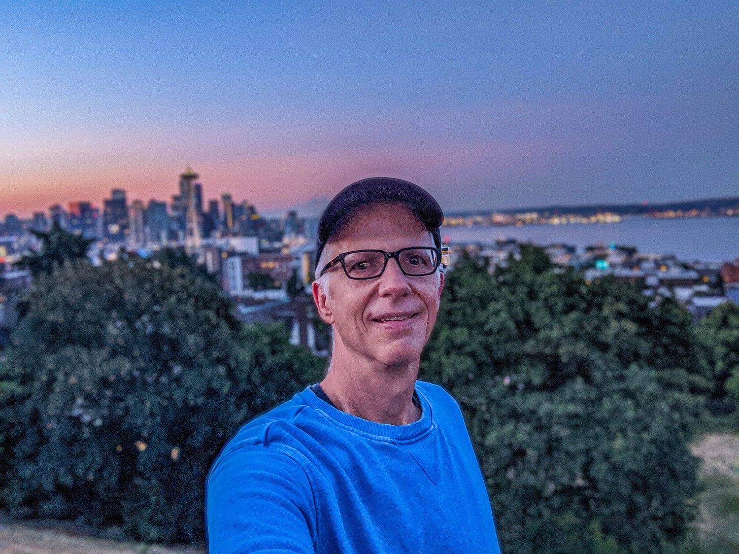 The city of Seattle behind Michael as the sun comes up.