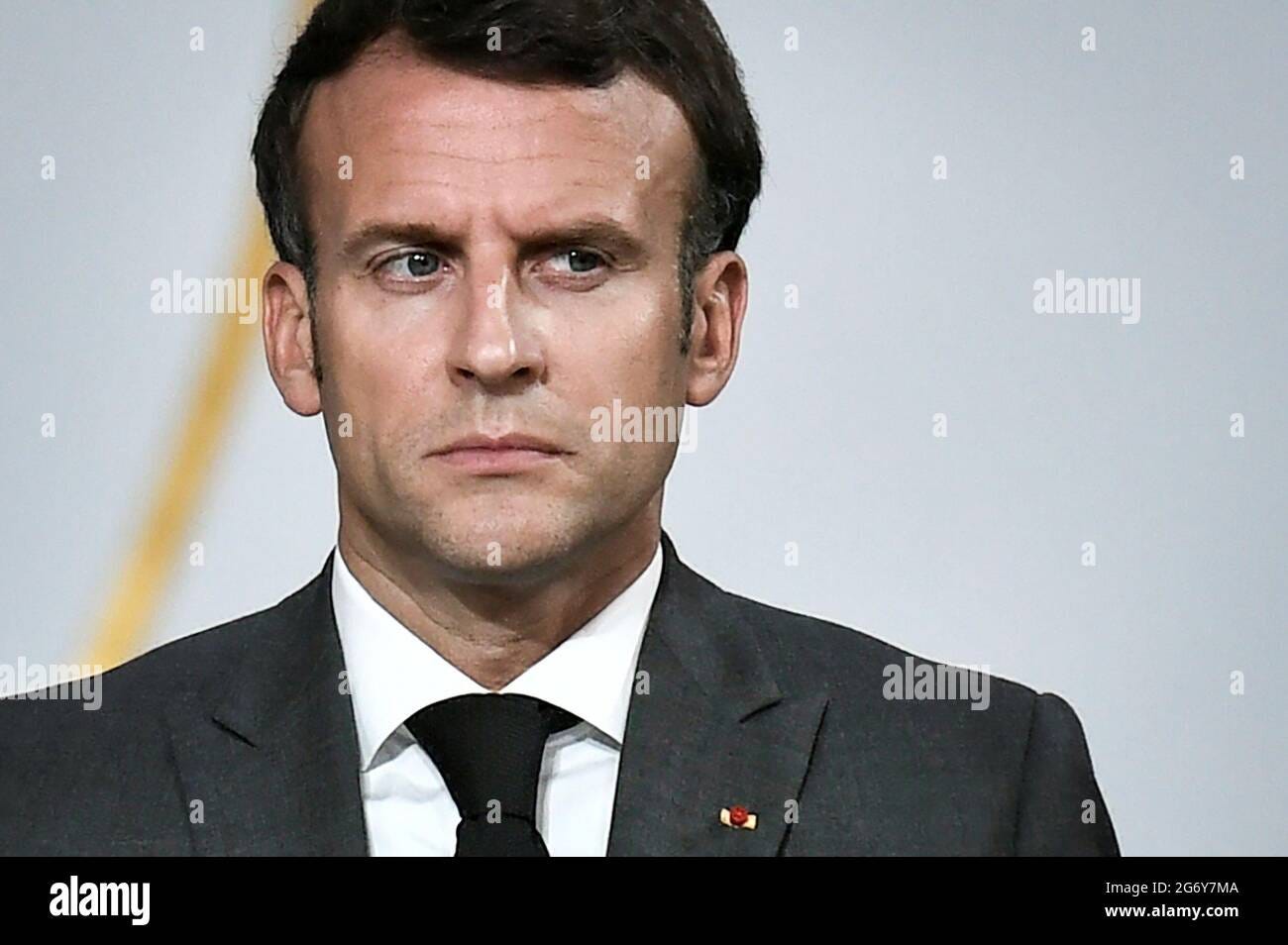 French President Emmanuel Macron reacts during a joint press conference  with Niger's President Mohamed Bazoum following a video summit with leaders  of G5 Sahel countries, at the Elysee presidential Palace, in Paris