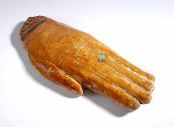 Wooden prosthetic hand from ancient Egypt. Model limbs were used during the embalming process to replace damaged or missing body parts, to ensure the body was complete for the afterlife. (Leeds Museums and Galleries / CC BY-NC-SA 3.0)