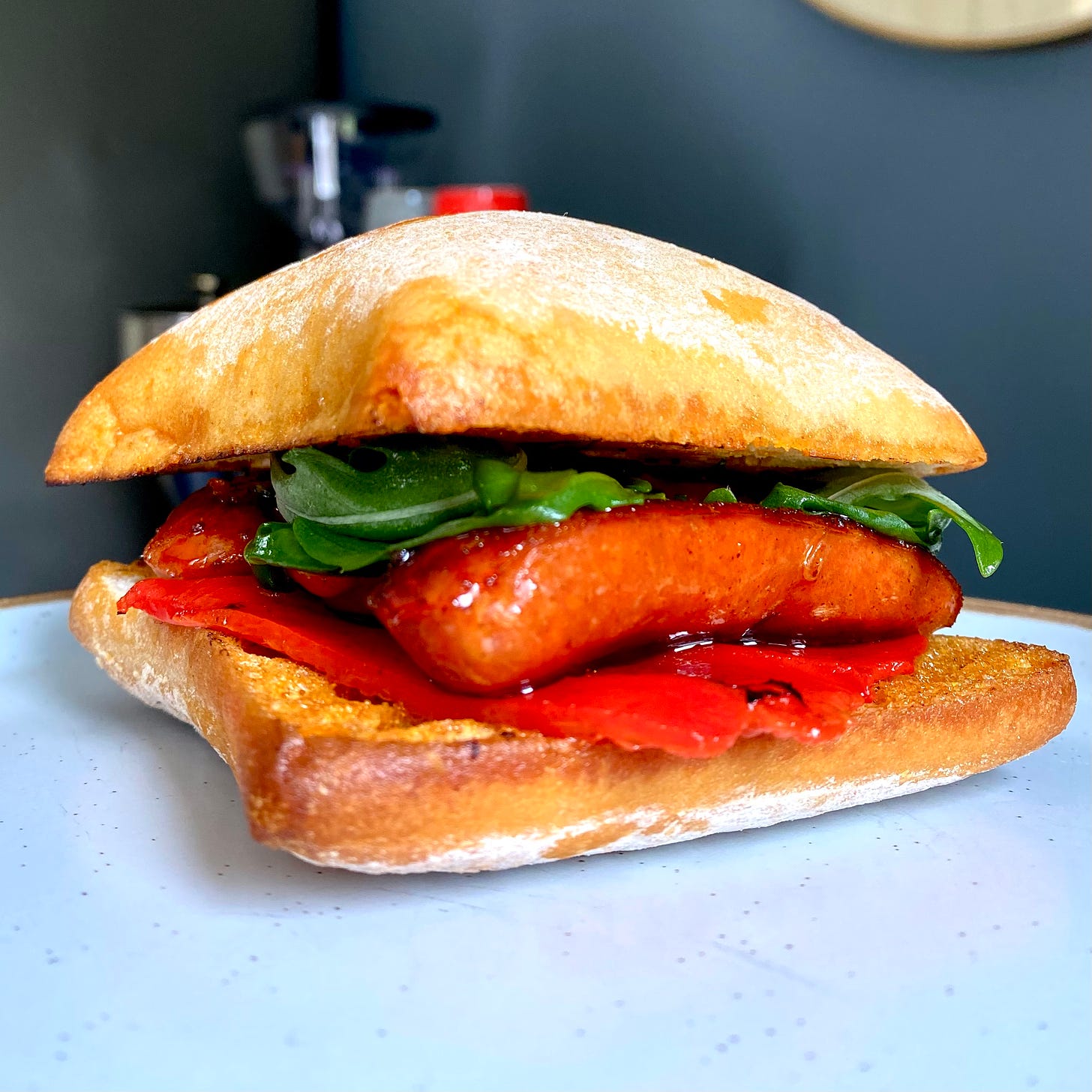 Ciabatta roll filled with chorizo, rocket and piquillo peppers
