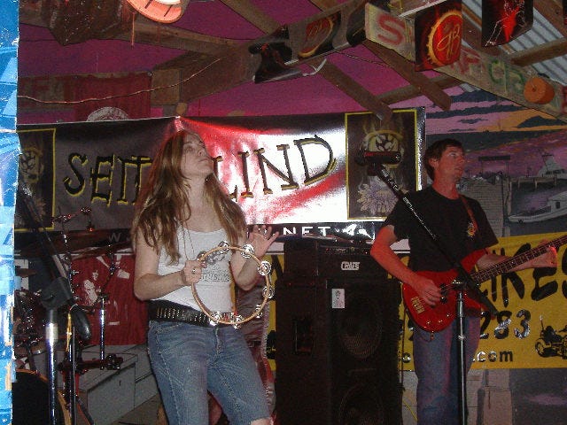 Michele doing the tamborine and Asher playing his bass. It's a great combination.