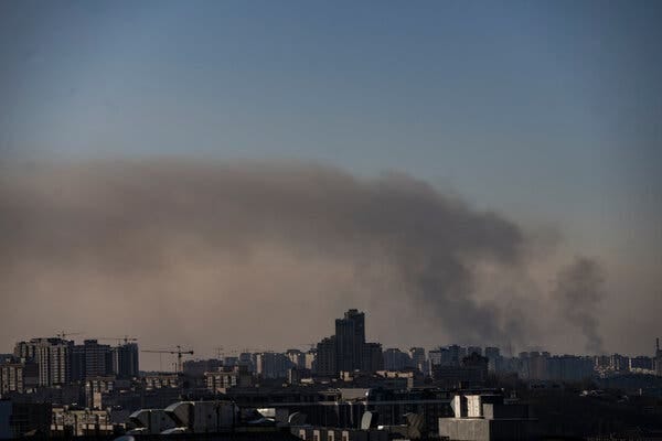 Smoke rises north of Kyiv during a citywide curfew in Kyiv, Ukraine, on Tuesday.