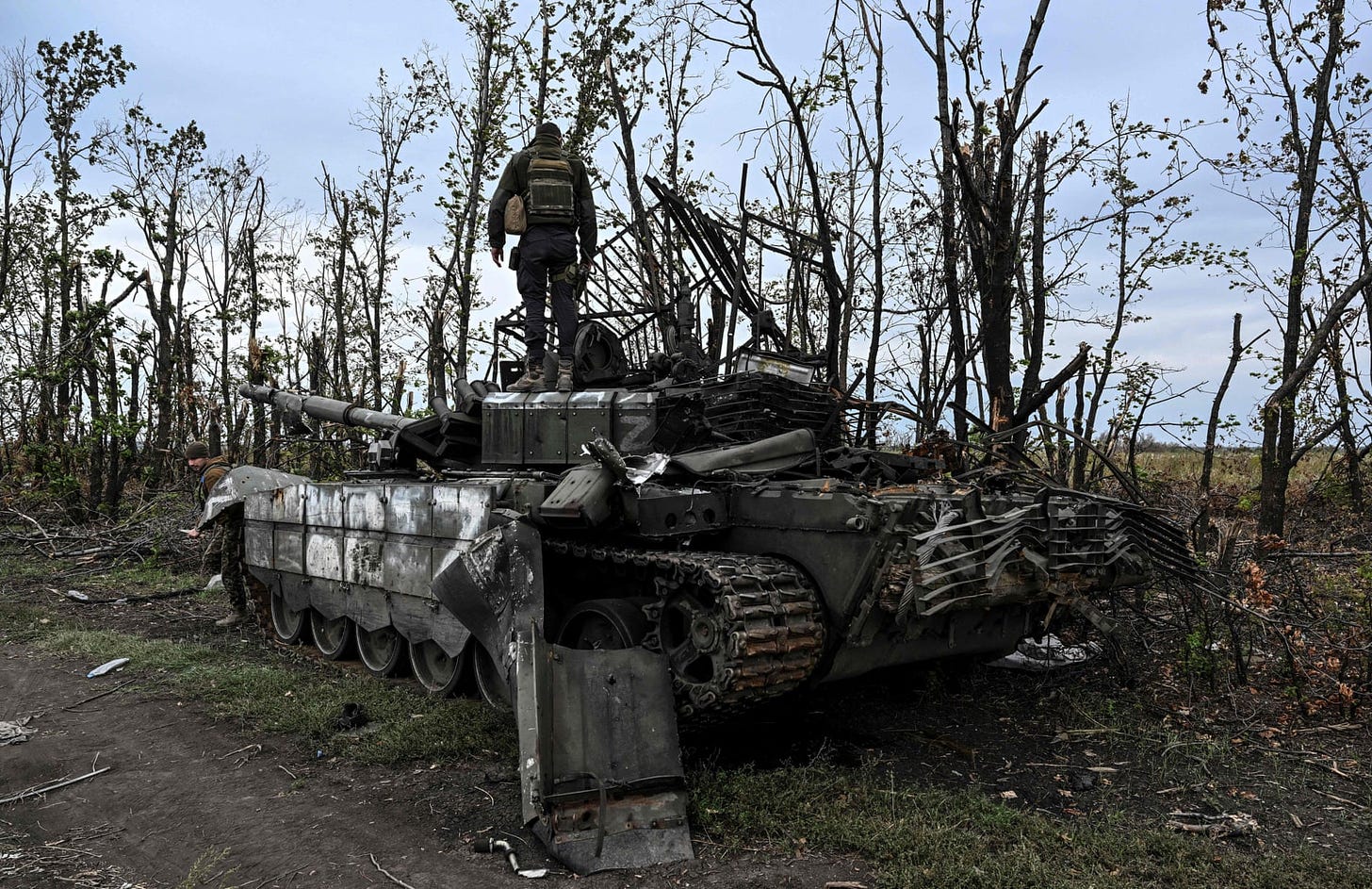 Ukrainian soldier standing on tank