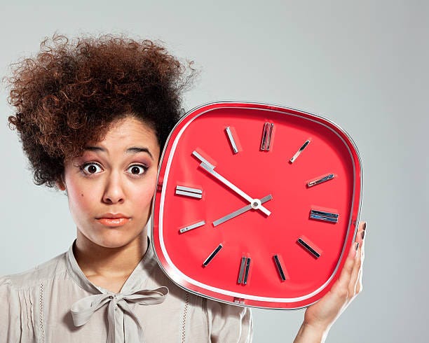 Afro Girl with Clock stock photo