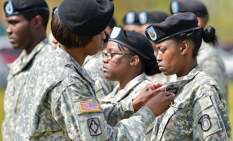 File:Soldiers of the 2nd Engineer Brigade change out their shoulder insignia for the USARAK insignia.jpg