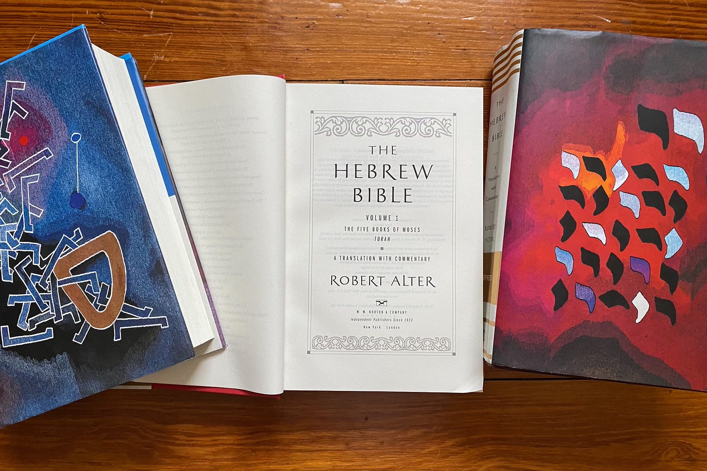 Robert Alter’s three-volume Hebrew Bible (W.W. Norton, 2019). The covers feature details from Israeli artist Mordecai Ardon’s tapestries of the Creation.
