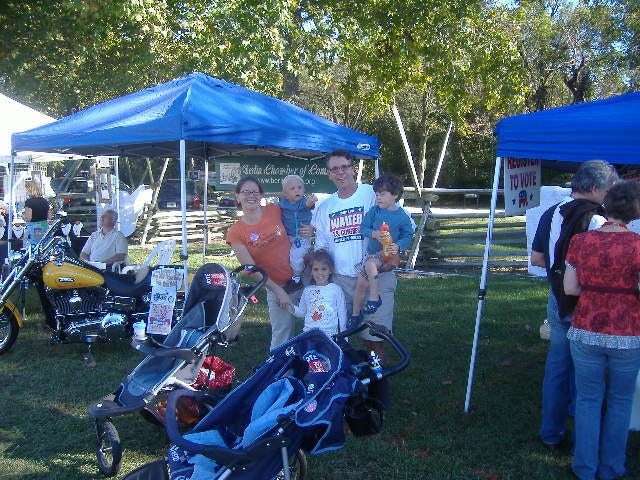 Congressional candidate John Leo Walter had his family in tow while campaigning Sunday. Something tells me kissing babies would be second nature to him.