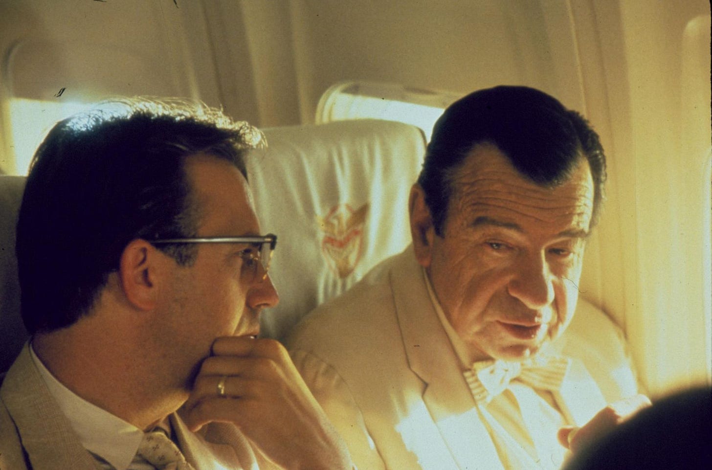 This image shows New Orleans District Attorney Jim Garrison (played by Kevin Costner, left) and Louisiana Senator Russell B. Long (played by Walter Matthau, right) chatting while on a flight to Washington D.C. in Oliver Stone's 1991 film JFK. This image shows New Orleans District Attorney Jim Garrison (played by Kevin Costner, left) and Louisiana Senator Russell B. Long (played by Walter Matthau, right) chatting while on a flight to Washington D.C. in Oliver Stone's 1991 film JFK.