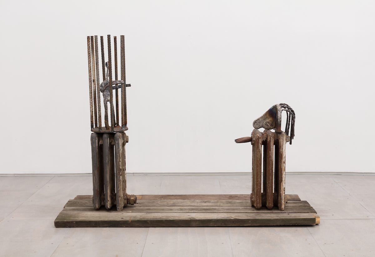 Emmanuel Desir, Captivity of the Spirit and the Flesh, 2019 steel, bronze, cast iron radiators, wood, wood planks